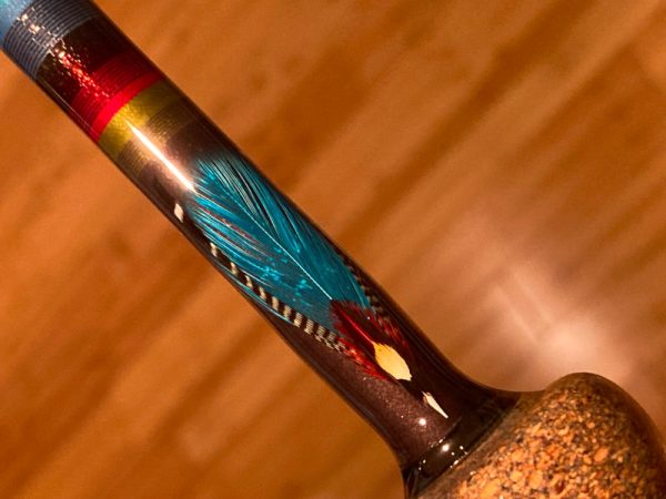 Spey rod with custom feather inlay