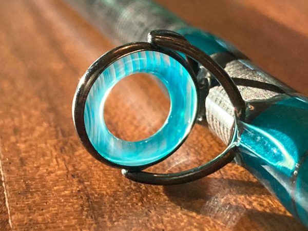 Custom spey rod with blue wrapping and agate guides